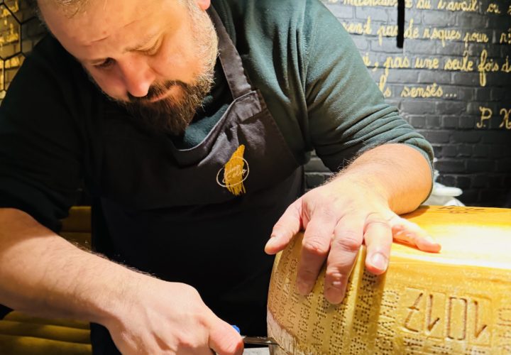 Chef Angelo Galasso opening Parmigiano Reggiano